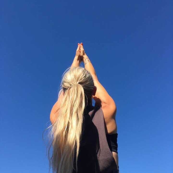 Becky reaching to sky